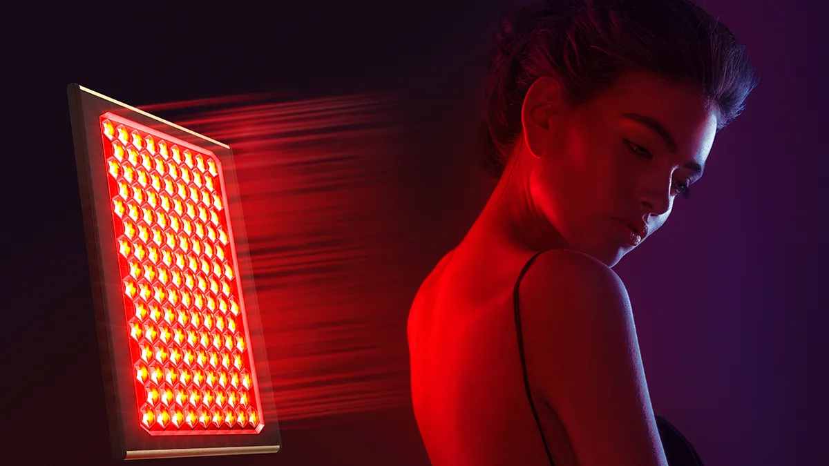 A woman using FAQ LED red light therapy panel on her back